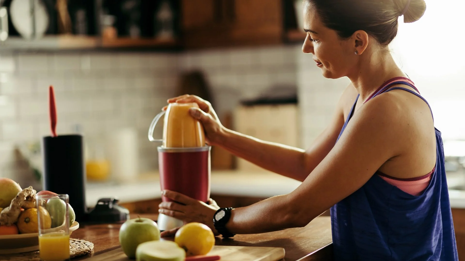 A athlete mixing a carbohydrate shake as part of her strategy for carb loading before a race.