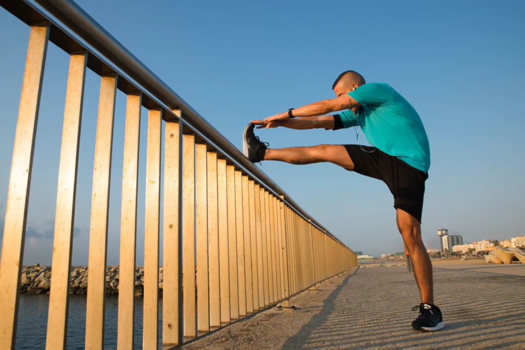 runner stretching to check their physical state and marathon recovery progress.